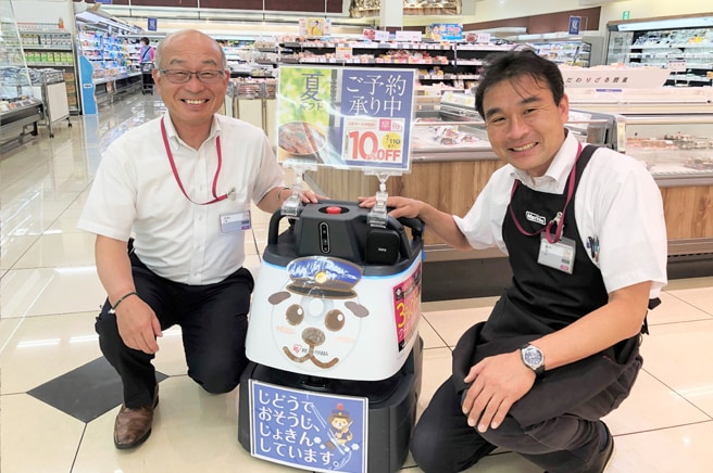 （左）株式会社光洋　総務部長　三輪靖彦　様
											（右）Maxvalu吹田千里丘店　店長　安部高史　様